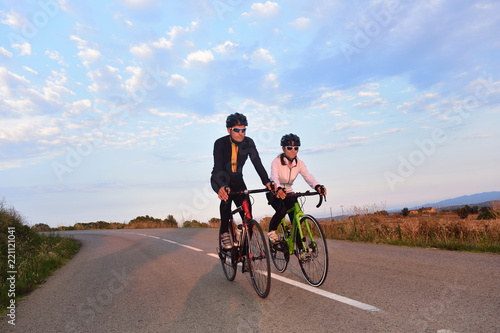 cycling couple on a road