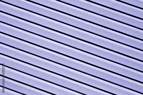 Plastic siding surface in blue color.