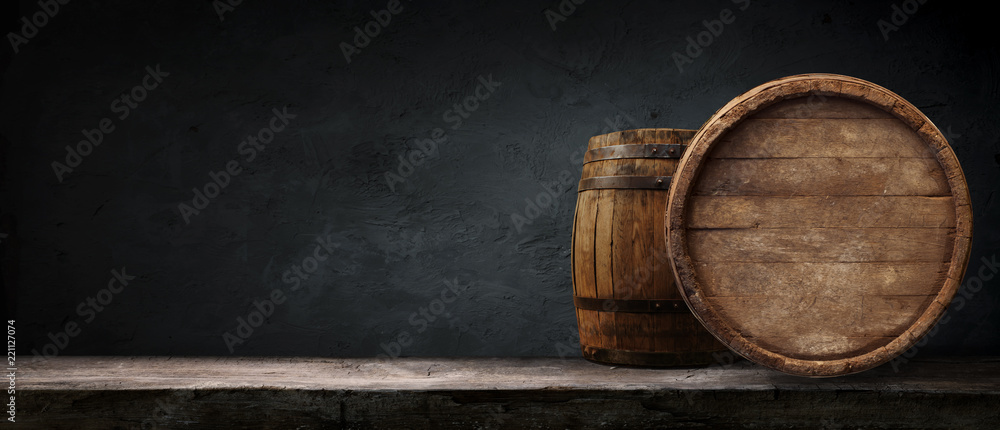 Oktoberfest beer barrel and beer glasses with wheat and hops on wooden table - obrazy, fototapety, plakaty 