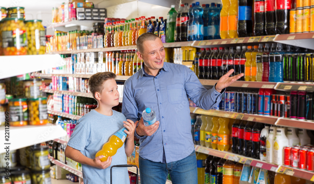 male and  boy  buying sweet beverages