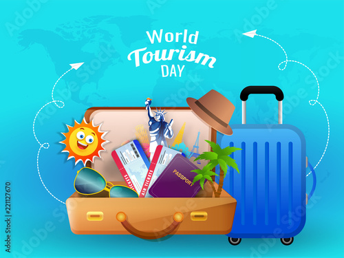 World tourism day concept based design with passport, statue of liberty, eyeglass in travelling bag on blue world map background for summer vacation.