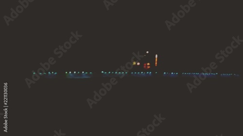 Tractor sprayer at night in the fog on the field. Agricultural machinery works in the field at night.
