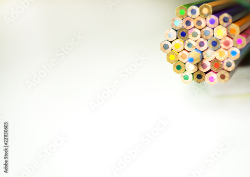 group of color pencils against white background for education concept