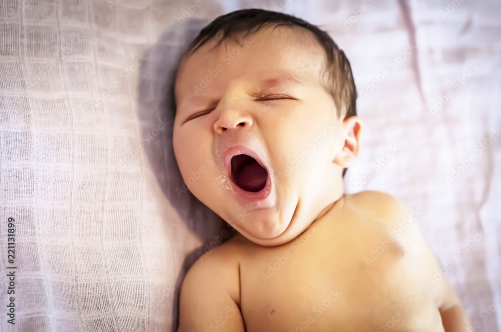 Funny newborn baby girl yawning with a trace of mother milk on her lips