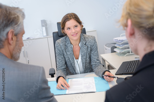 Photos Couple in meeting with businesswoman