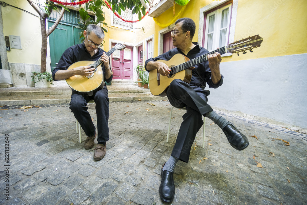 Fototapeta premium Two fado guitarists with acoustic and portuguese guitars