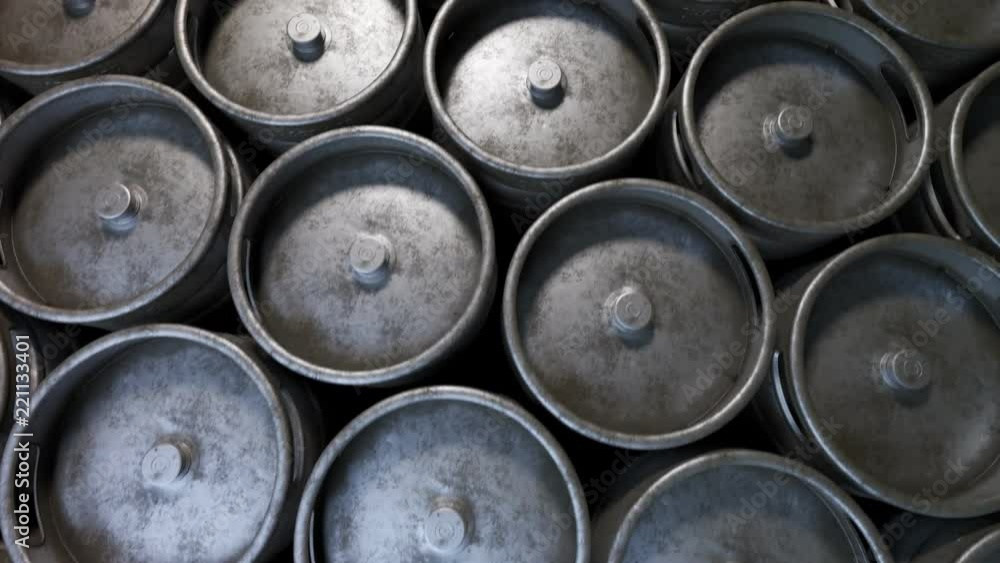 Multiple metal beer kegs stacked on the ground in endless, seamless loop. 4K HD