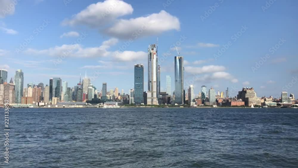 Skyline of New York City across the Hudson River from New Jersey with the choppy river water moving Skyline of New York City across the Hudson River from New Jersey with the choppy river water moving