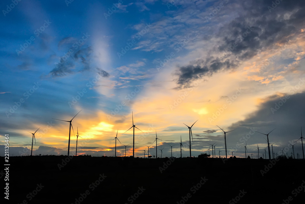 wind turbine against sunset wind turbine against sunset