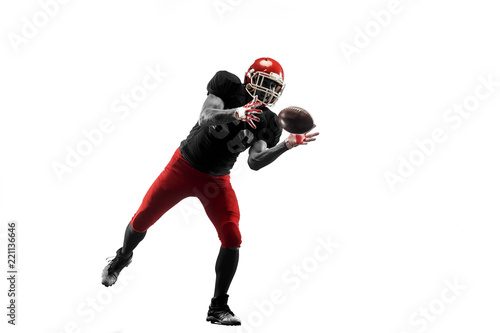 Active one american football player isolated on white background. Fit caucasian man in uniform running over studio background in jump or motion. Human emotions and facial expressions concept