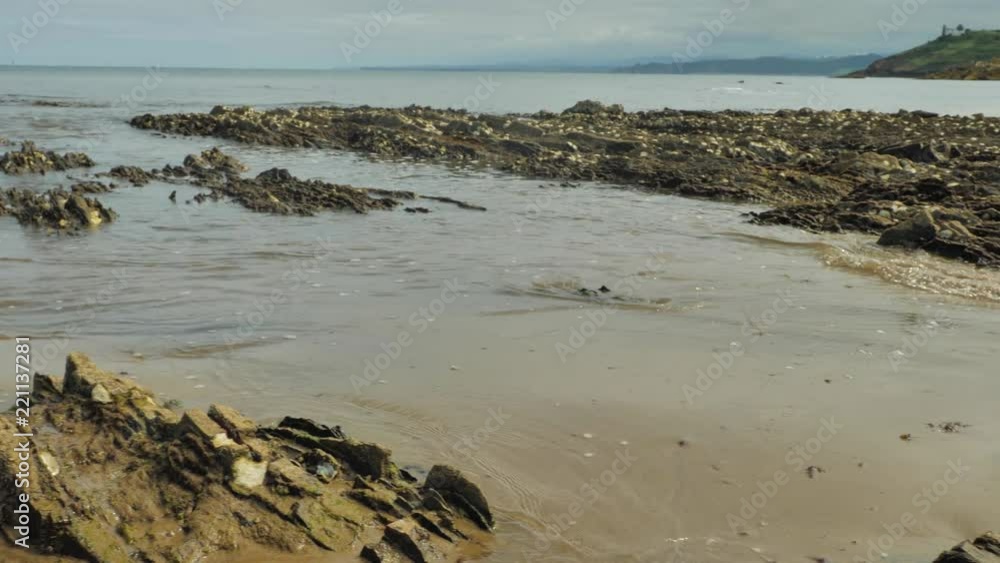 Uninhabited Wild Atlantic Ocean Coast with Rocks and Sand of Nordic Style Nature Environment at the North of Spain Uninhabited Wild Atlantic Ocean Coast with Rocks and Sand of Nordic Style Nature Environment at the North of Spain