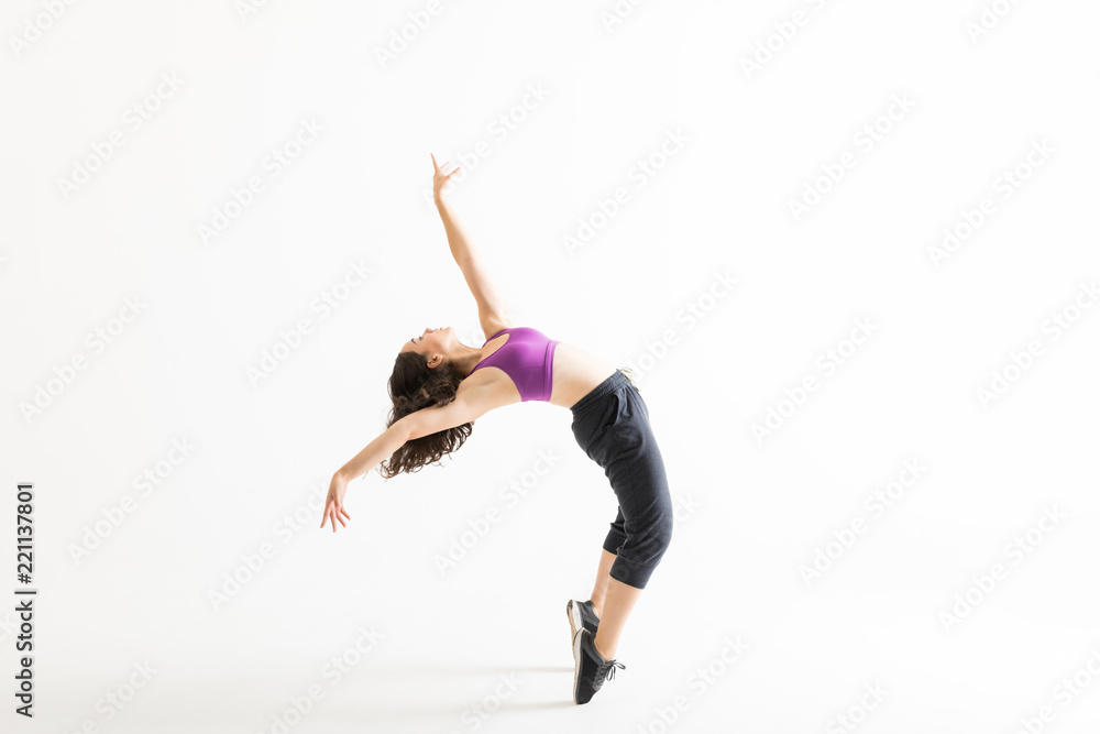 Fototapeta premium Jazz Dancer On Tiptoes Bending Backward On White Background
