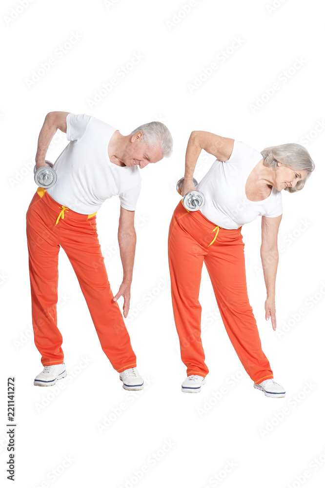 Portrait of active smiling senior couple doing exercise Portrait of active smiling senior couple doing exercise