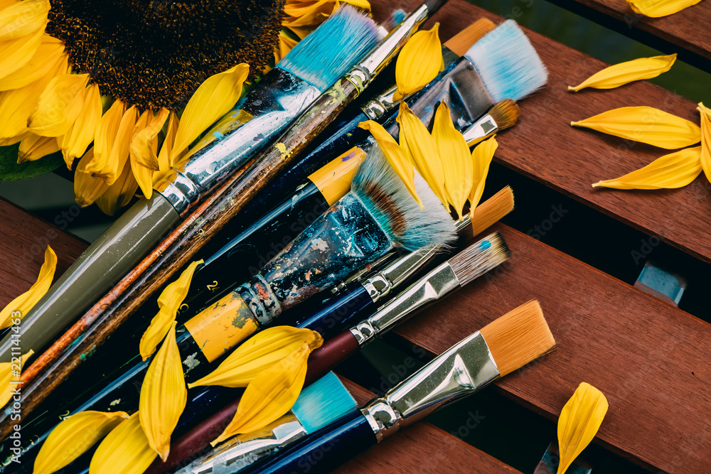 Fotografie Artistic brushes on wooden table