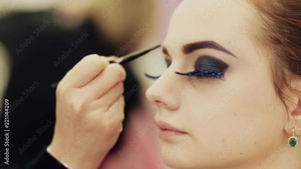 makeup artist applies makeup to model makeup artist applies makeup to model