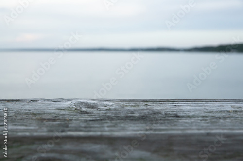 Wooden Ledge on Pier with Ocean View in Distance
