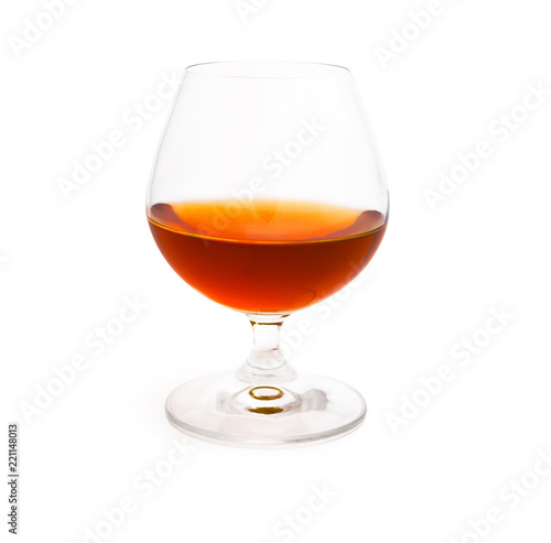 Wineglass with cognac isolated on white background