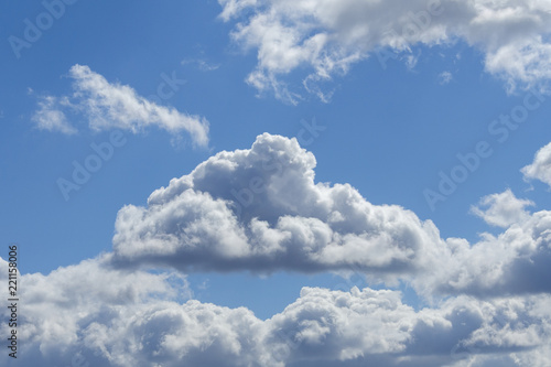 Gray fluffy clouds in the overcast sky (background)