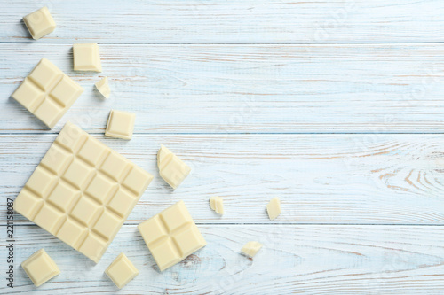 White chocolate pieces on wooden table