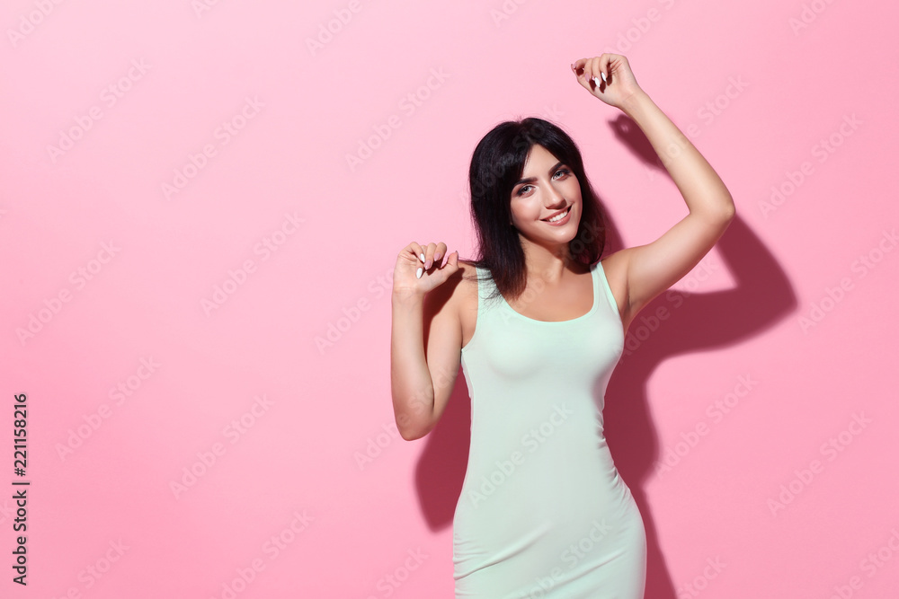 Young woman in white dress on pink background Young woman in white dress on pink background