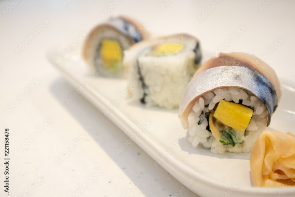 Saba sushi roll on white plate Saba sushi roll on white plate