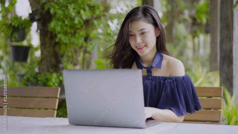 happy woman using laptop computer