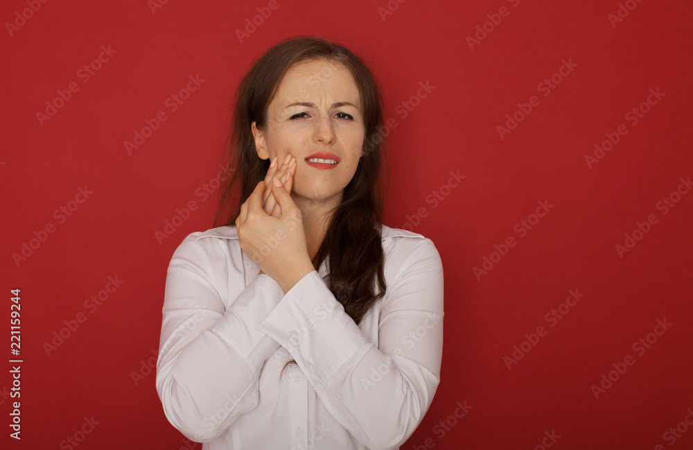 Teeth Problem. Woman Feeling Tooth Pain. Closeup Of Beautiful Sad Girl Suffering From Strong Tooth Pain. Attractive Female Feeling Painful Toothache. Dental Health And Care Concept. On Red Background. Teeth Problem. Woman Feeling Tooth Pain. Closeup Of Beautiful Sad Girl Suffering From Strong Tooth Pain. Attractive Female Feeling Painful Toothache. Dental Health And Care Concept. On Red Background.