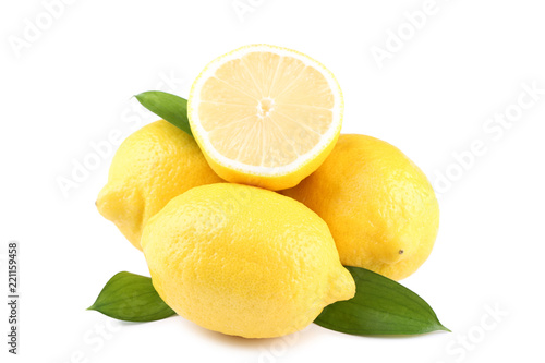 Ripe lemons with green leafs isolated on white background