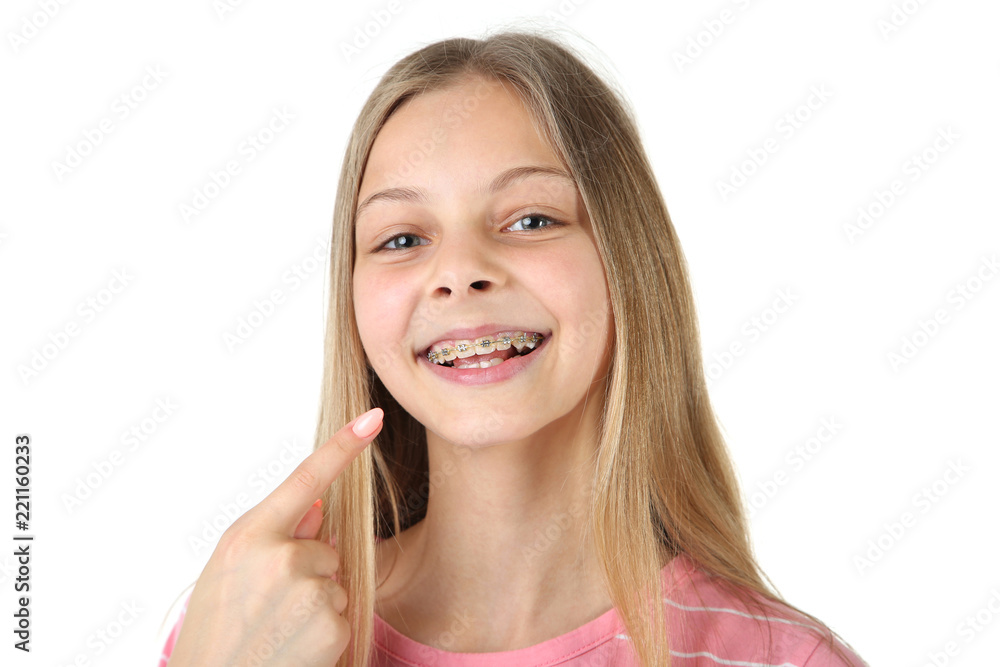 Young smiling girl with dental braces on white background Young smiling girl with dental braces on white background