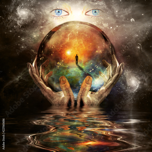 фотографія Crystal ball in hands of creator