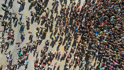 Aerial top view of a crowd people at the square. Mass gathering of people.