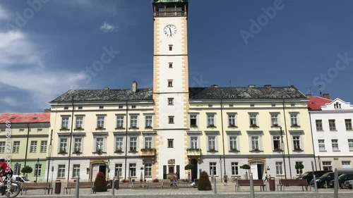 Biker riding the bicycle on historical square in front of town hall in Litovel, Czech Republic. photo