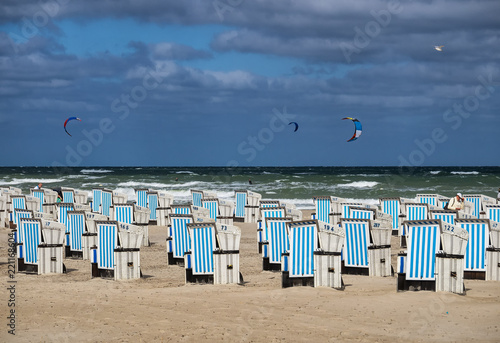 Fototapeta Naklejka Na Ścianę i Meble -  Beach baskets on a windy day in Warnemunde at the Baltic Sea, Germany