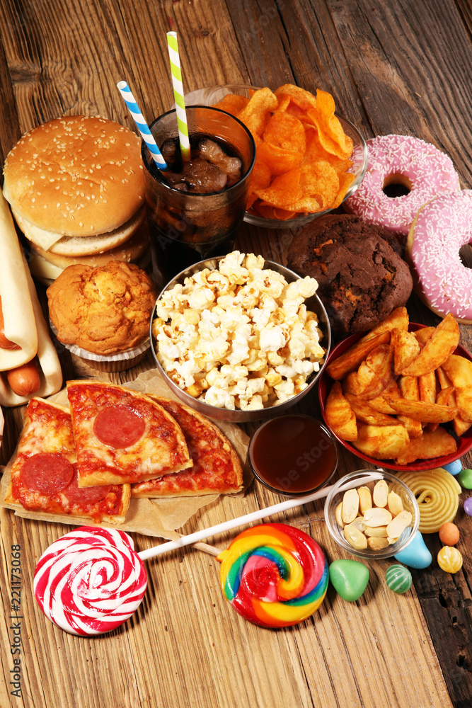 Fototapeta premium Unhealthy products. food bad for figure, skin, heart and teeth.