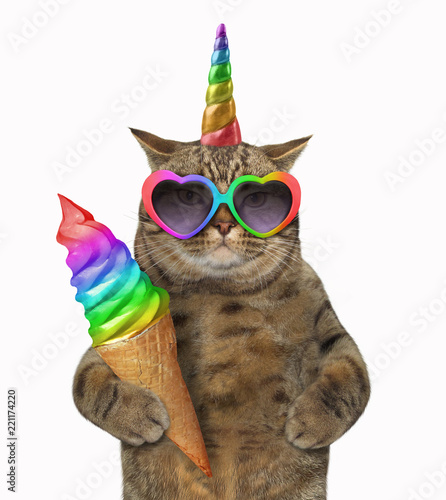 The cat unicorn in glasses is holding rainbow ice cream. White background.
