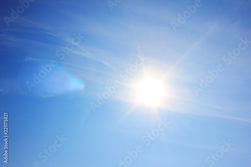 Blue Sky with Shining Sun Background, Bright Natural Image of Vibrant Blue Sky with No Clouds and Bright Sun Rays. Natural Blue Colorful Sky Wallpaper with Patch of Reflected Sun Light Shades