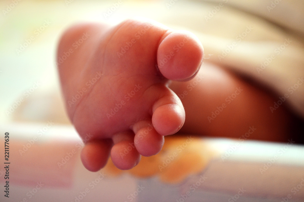 Baby's little foot, cute tiny toe and fingers Baby's little foot, cute tiny toe and fingers