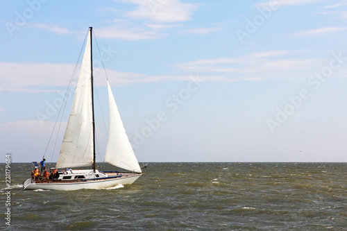 Sailboat yacht rushes along the waves. © zurbagan