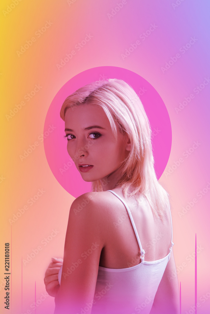 Creative art. Attractive young woman standing against pink background while taking part in a creative photoshoot Creative art. Attractive young woman standing against pink background while taking part in a creative photoshoot