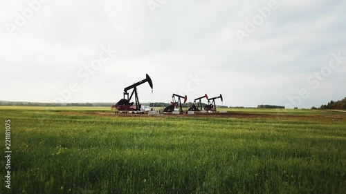 Aerial Drone Shot Flying over Alberta Oil Derricks, Alberta Canada, Prairie
