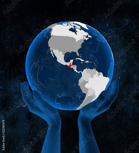 Guatemala on globe in hands