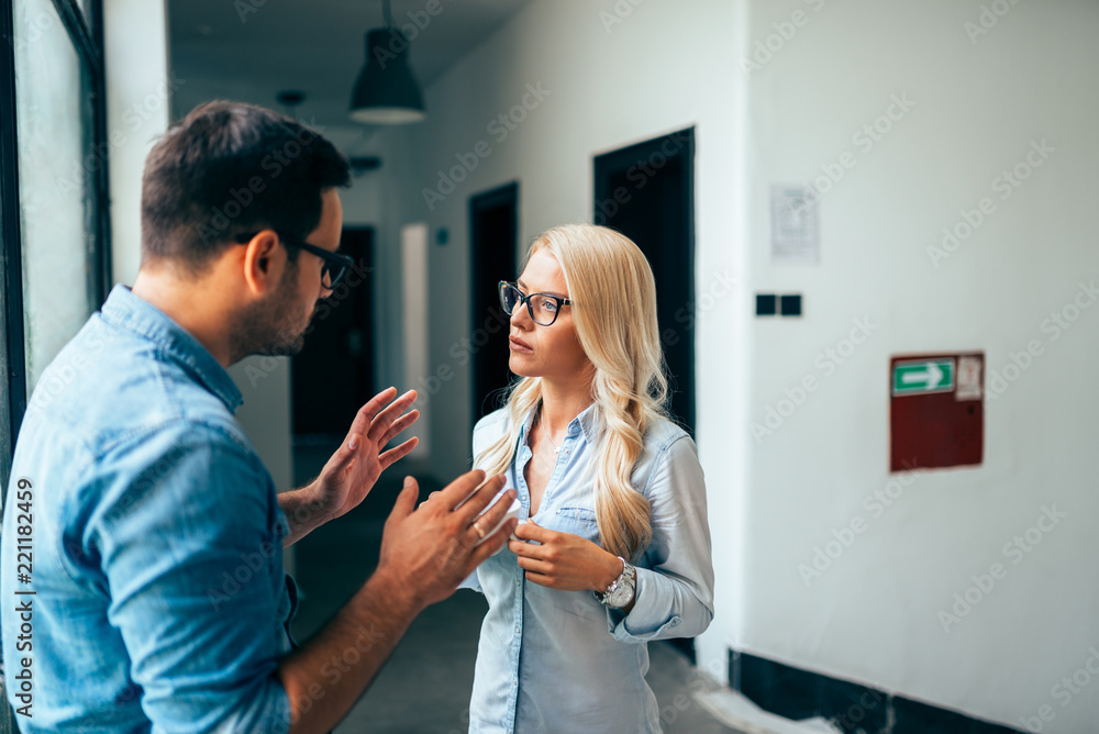 custom made wallpaper toronto digitalYoung couple or coworkers discussing in the lobby.
