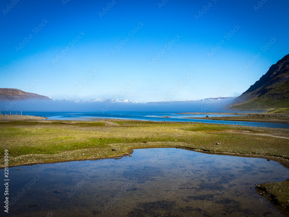 Fog in the fjord valley in Iceland