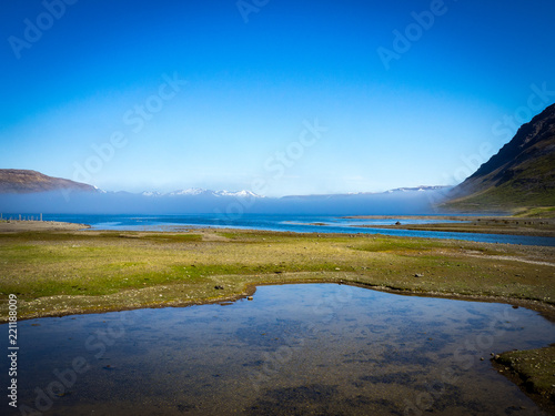 Fog in the fjord valley in Iceland