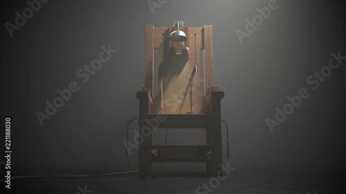 Wooden electric chair in the foggy room spotlight. Camera slow pan. 4K HD