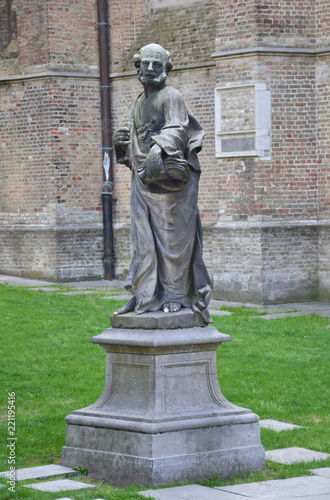 Statue in front of church of Our Lady in Bruges, Belgium