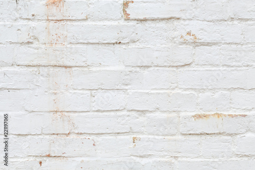 Old brick wall painted white