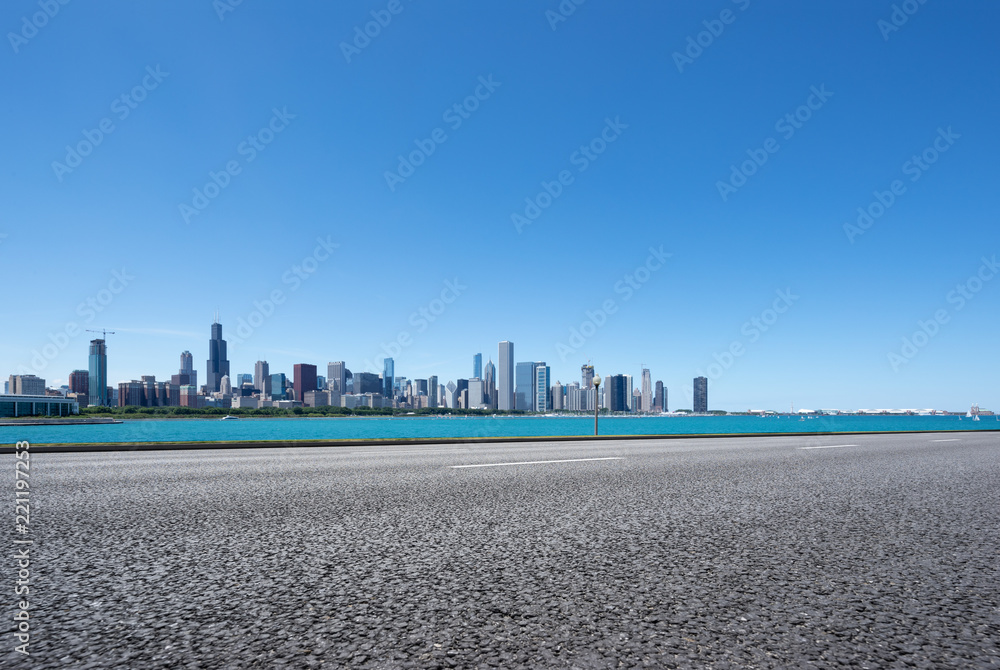 Naklejka premium asphalt highway with modern city in chicago
