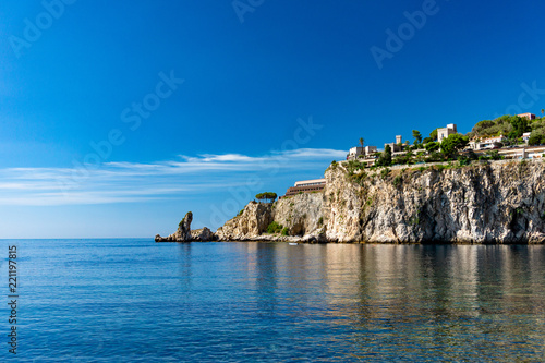 View from the famous Isola Bella beach to the cliff with Taormina city on the top  Sicily  Italy 