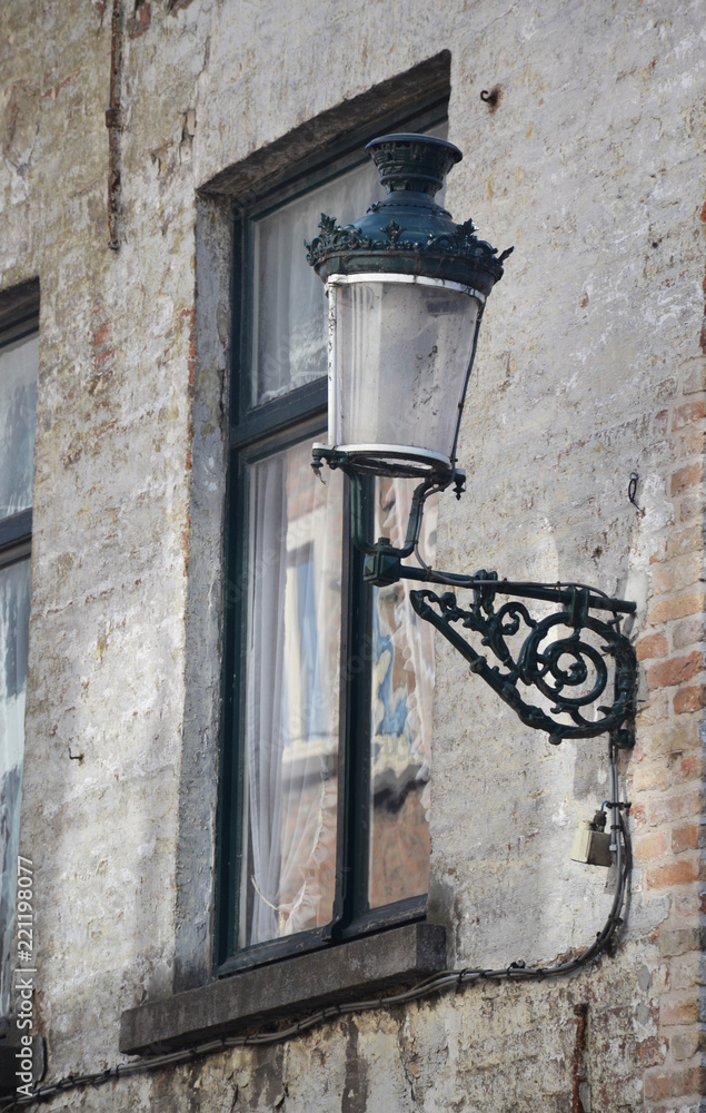 Lamp-street in the narrow street house walls